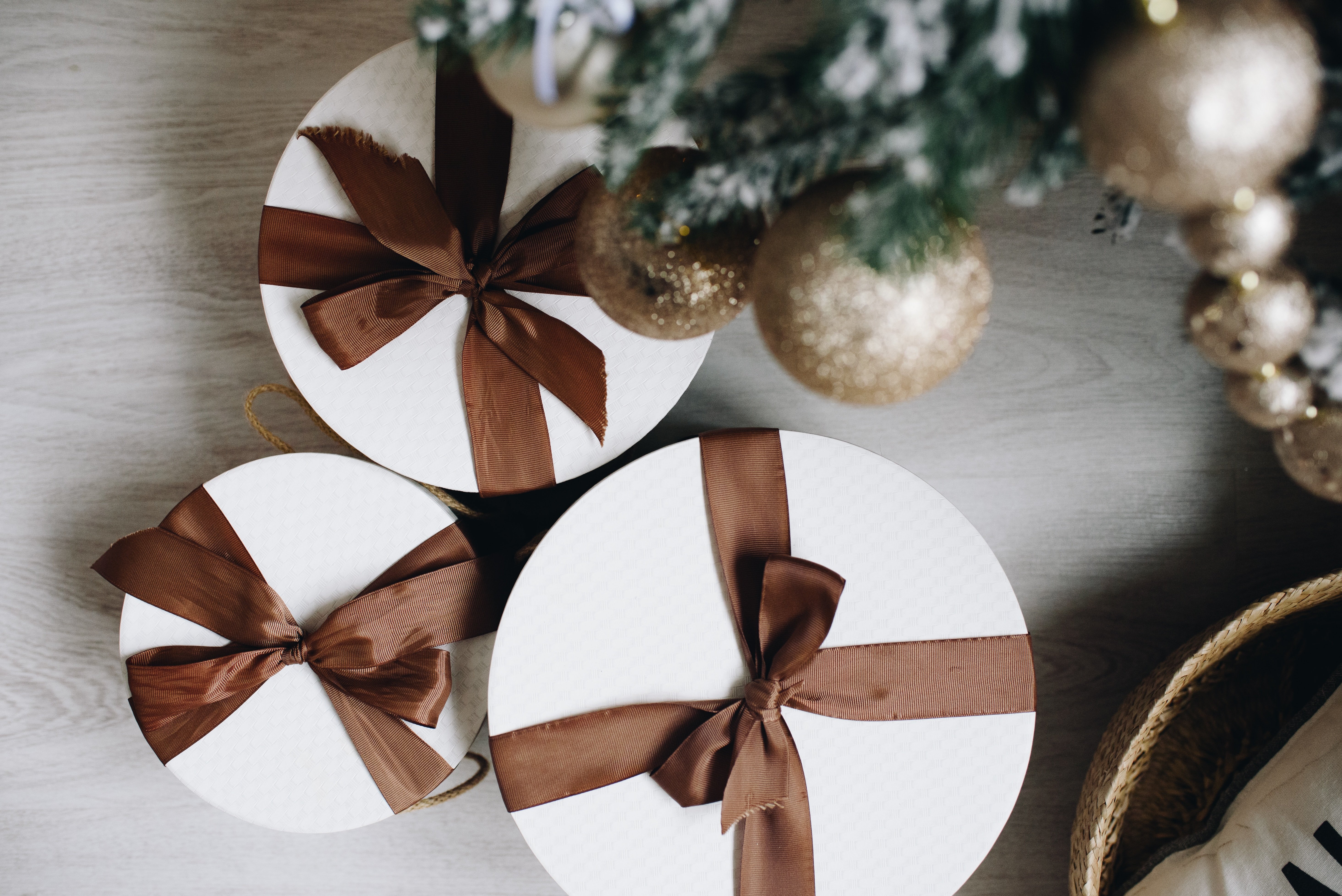 Holiday gifts under a christmas tree on a vinyl floor